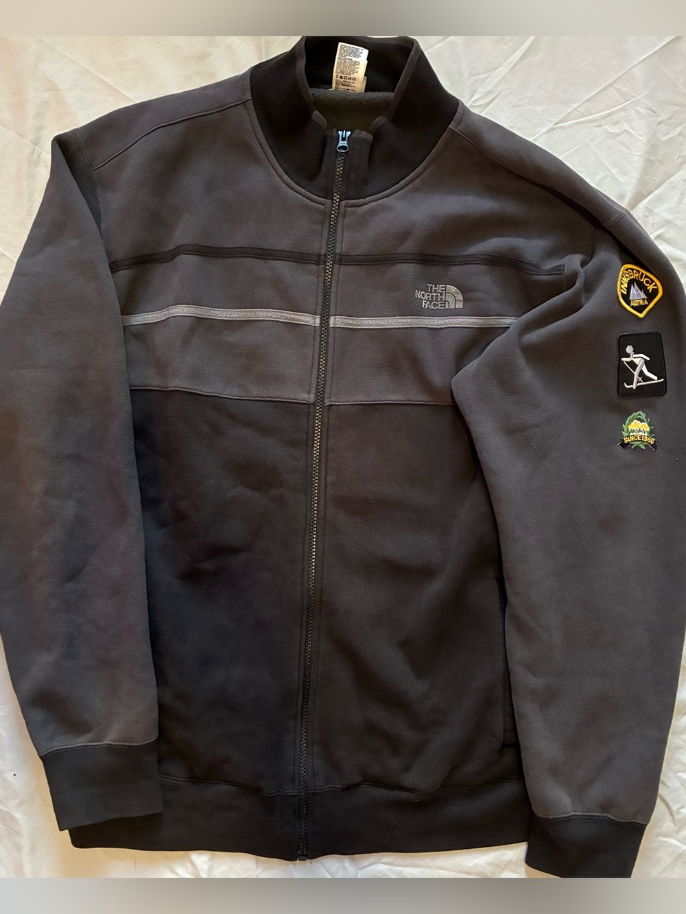 The North Face Charcoal Jacket with Yellow Innsbruck Patch